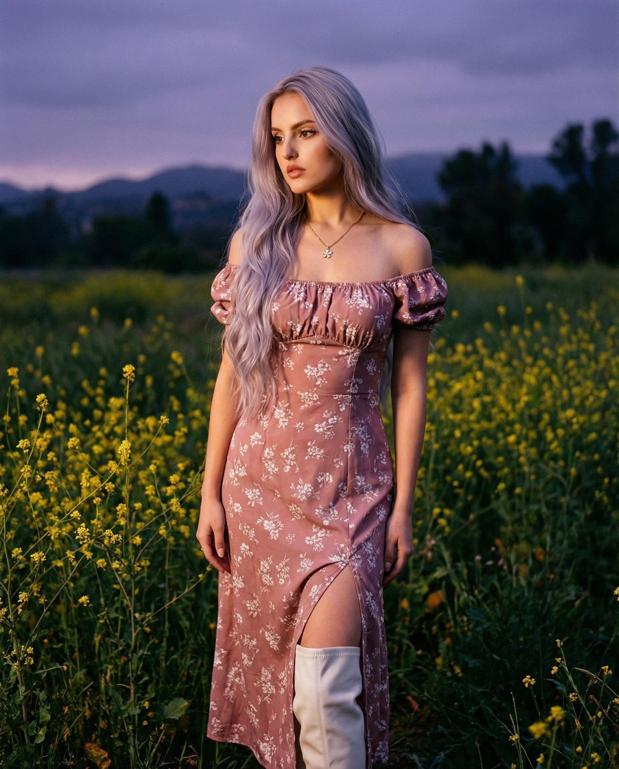 Allison Hernandez in a floral dress, full length, in a field at dusk.